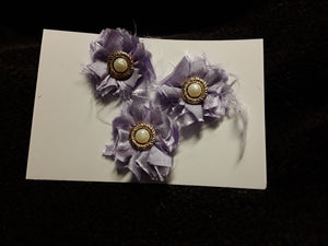 Three Little Purple Satin Flowers